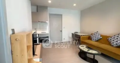 Modern living room with cozy sofa and dining area in stylish apartment.