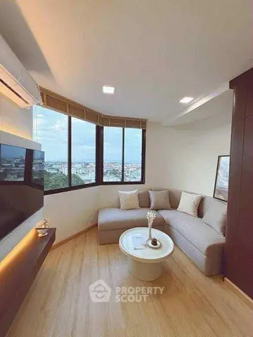 Modern living room with panoramic city view and stylish furniture