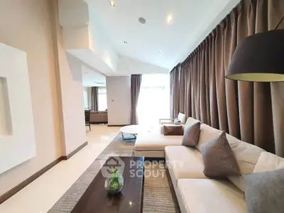 Spacious modern living room with elegant decor and natural light