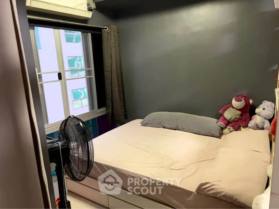 Cozy bedroom with plush toys and modern decor in urban apartment