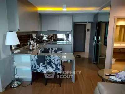 Modern open-layout kitchen with stylish dining area and sleek appliances