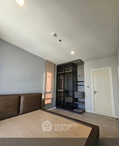 Modern bedroom with sleek built-in wardrobe and minimalist design