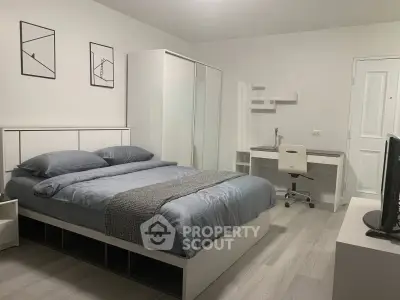 Modern bedroom with sleek furniture and minimalist decor, perfect for a cozy and stylish living space.