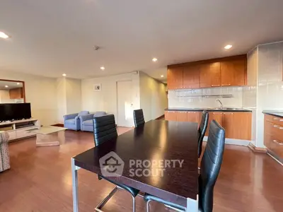 Spacious open-plan living room with modern kitchen and dining area