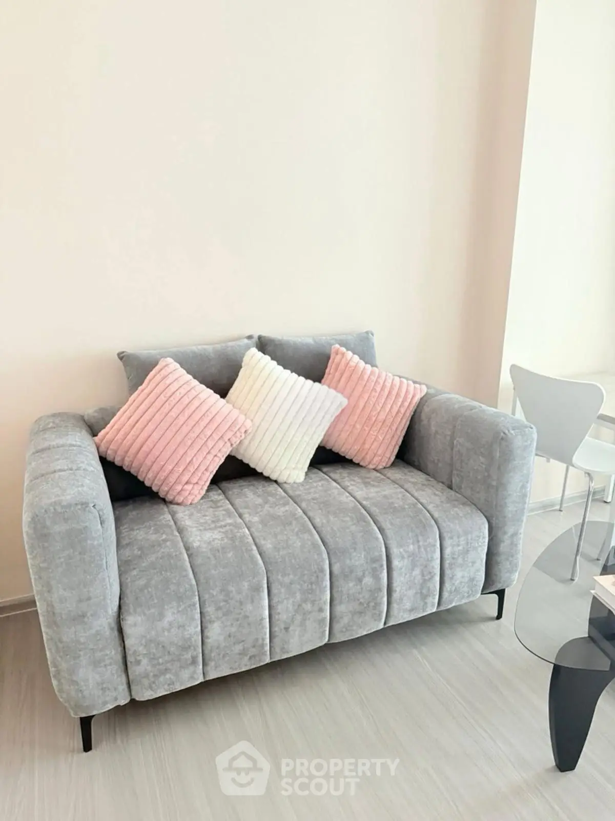 Stylish modern living room with plush gray sofa and chic decor
