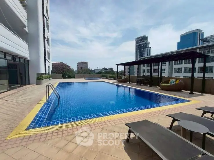 Luxurious rooftop pool with city views in modern apartment complex