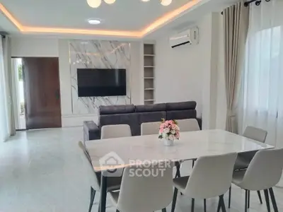Modern living room with elegant dining area and stylish decor