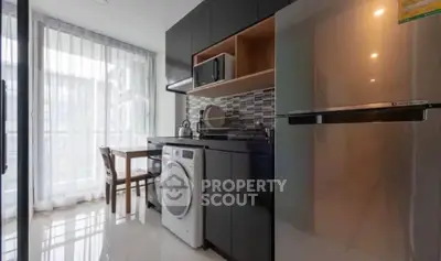 Modern kitchen with sleek appliances and natural light