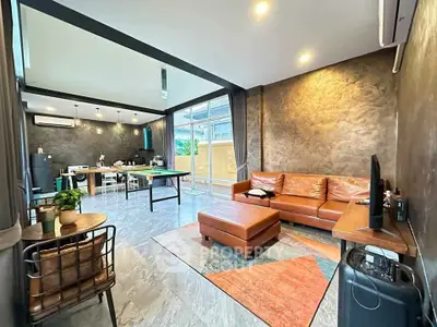 Spacious modern living room with open kitchen and stylish decor