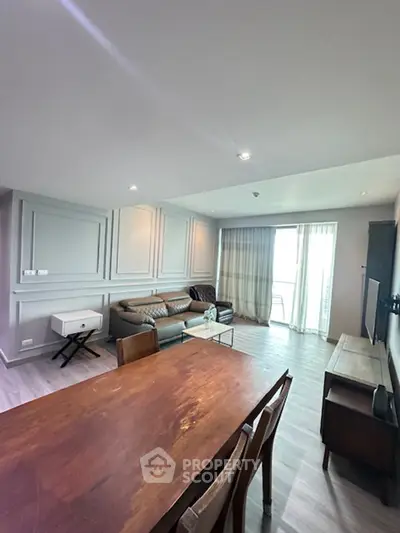 Spacious living room with modern decor and natural light