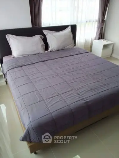 Cozy bedroom with modern decor and natural light