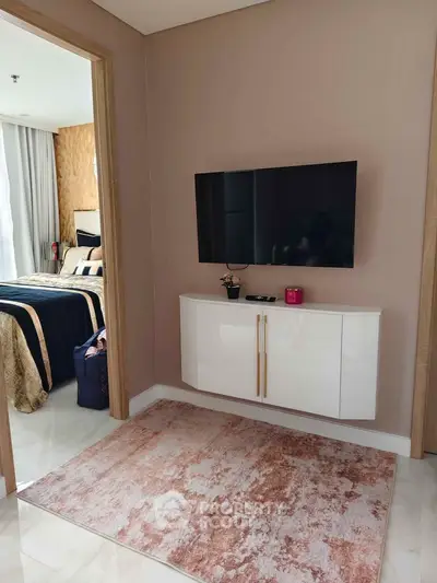 Stylish bedroom entrance with modern decor and wall-mounted TV