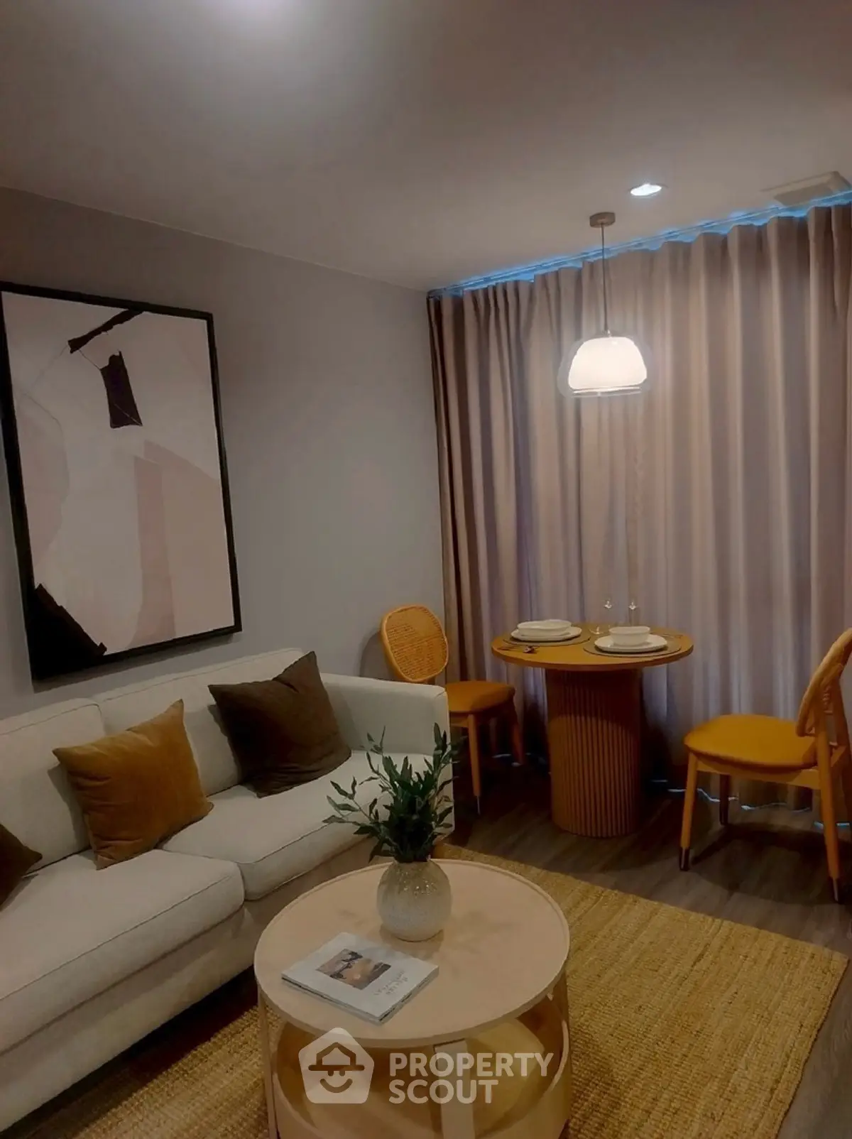 Cozy living room with modern decor and dining area