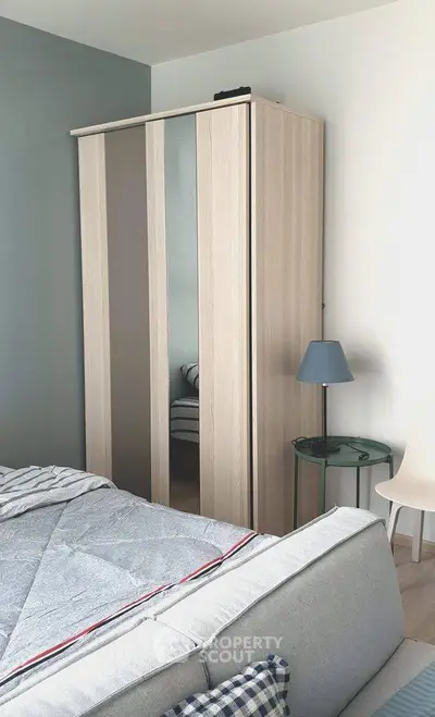 Modern bedroom with stylish wardrobe and cozy decor