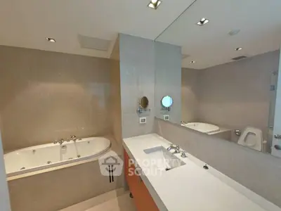 Luxurious bathroom with jacuzzi tub and modern fixtures