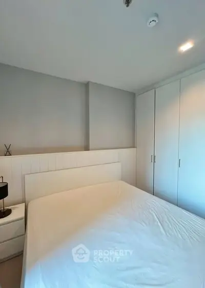 Cozy bedroom with minimalist design and ample closet space