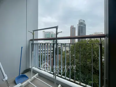 Spacious balcony with city view, perfect for relaxation and enjoying the skyline.