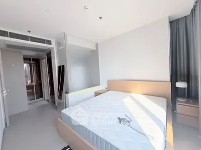 Bright and modern bedroom with large window and minimalist design