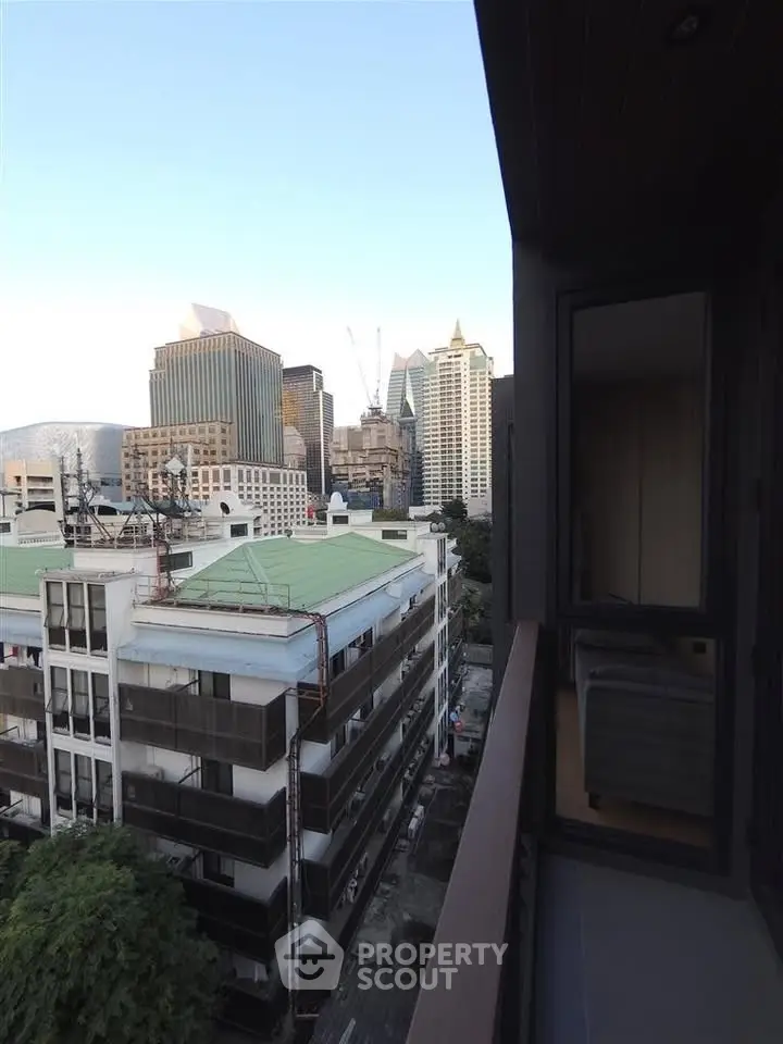 Stunning cityscape view from a modern apartment balcony, showcasing urban living at its finest.