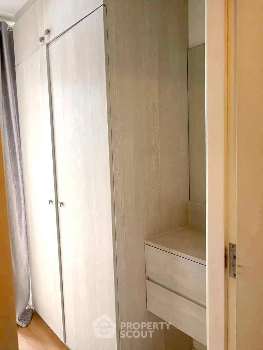 Modern storage space with sleek wooden cabinets and drawers