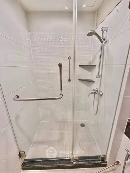 Modern bathroom shower with glass door and sleek fixtures