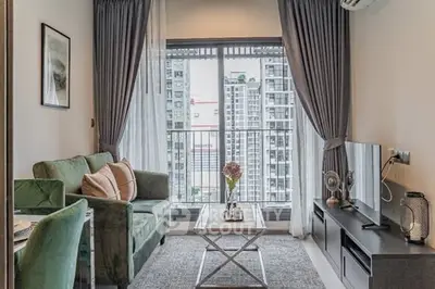 Modern living room with city view, stylish furniture, and elegant decor.
