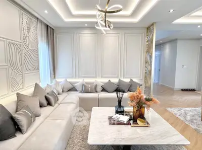 Luxurious living room with elegant decor and modern lighting