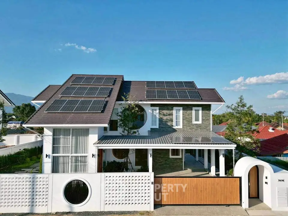 Modern two-story house with solar panels and stylish exterior design