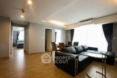 Spacious modern living room with sleek furniture and natural light