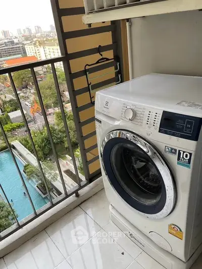 Modern washing machine on balcony with city and pool view, perfect for urban living.