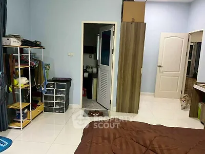 Spacious bedroom with modern decor and ample storage space