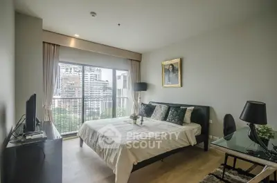 Modern bedroom with large window and city view, featuring elegant decor and natural light.