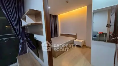 Modern bedroom with ambient lighting and sleek wooden flooring