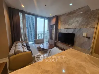 Luxurious living room with marble accents and city view from high-rise apartment
