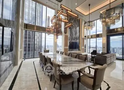 Luxurious high-rise living room with panoramic city views and elegant modern decor.