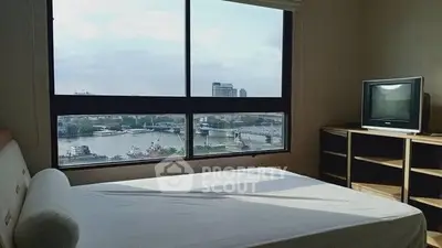 Spacious bedroom with stunning river view and natural light