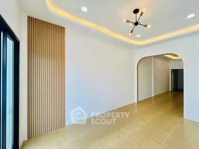 Modern minimalist interior with stylish lighting and wooden flooring