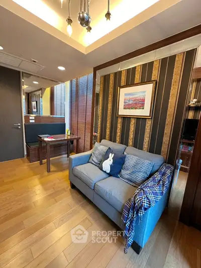 Stylish living room with cozy sofa and modern decor in a contemporary apartment.