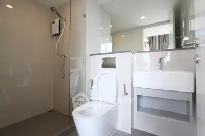 Modern bathroom with sleek design and glass shower enclosure