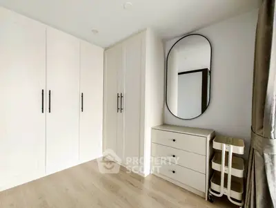 Spacious bedroom with modern wardrobe and elegant mirror design