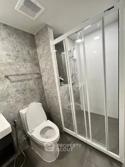 Modern bathroom with sleek shower enclosure and stylish tile design