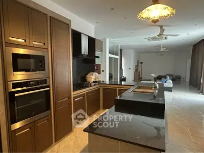 Spacious modern kitchen with sleek appliances and open layout in luxury home