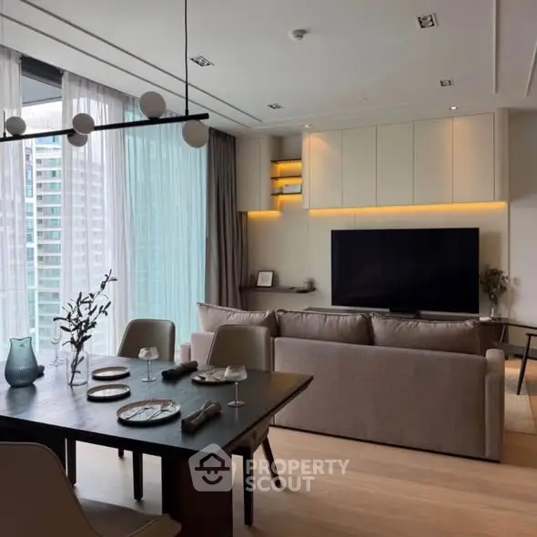 Modern living room with elegant dining area and large TV, featuring floor-to-ceiling windows and stylish lighting.