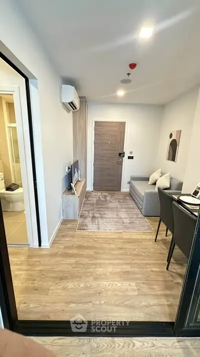 Modern apartment entrance with cozy seating and stylish decor
