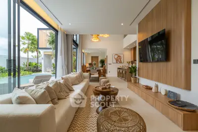 Luxurious modern living room with pool view and elegant decor