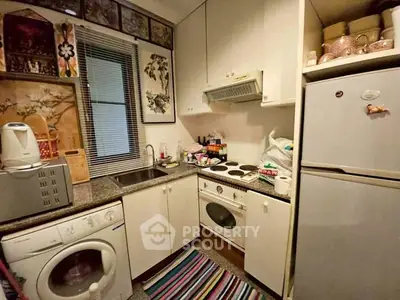 Cozy kitchen with compact appliances and colorful decor