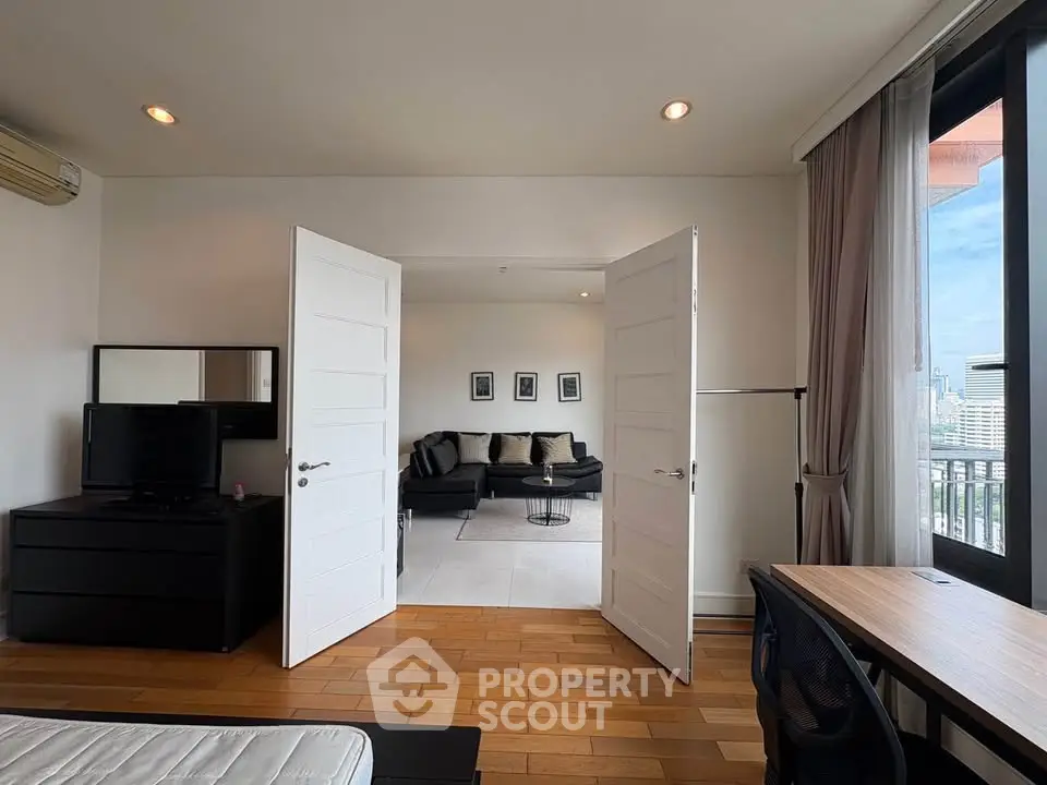 Spacious modern apartment with wooden floors and city view