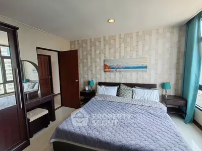 Spacious bedroom with modern decor and large windows offering city views.