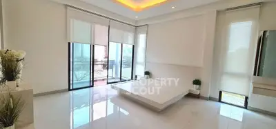 Spacious modern living room with large windows and minimalist decor