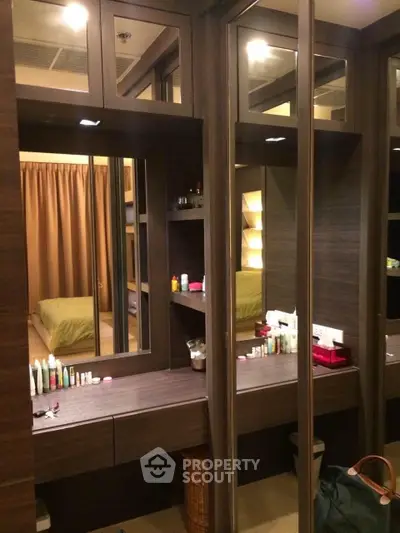 Luxurious bedroom with elegant vanity and ample storage space, perfect for modern living.